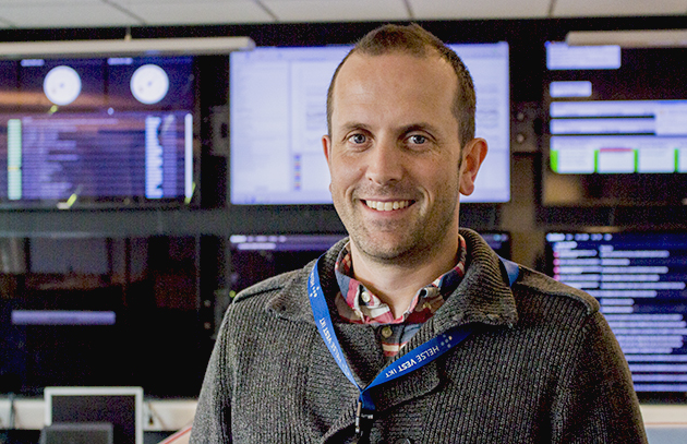 A man wearing a lanyard